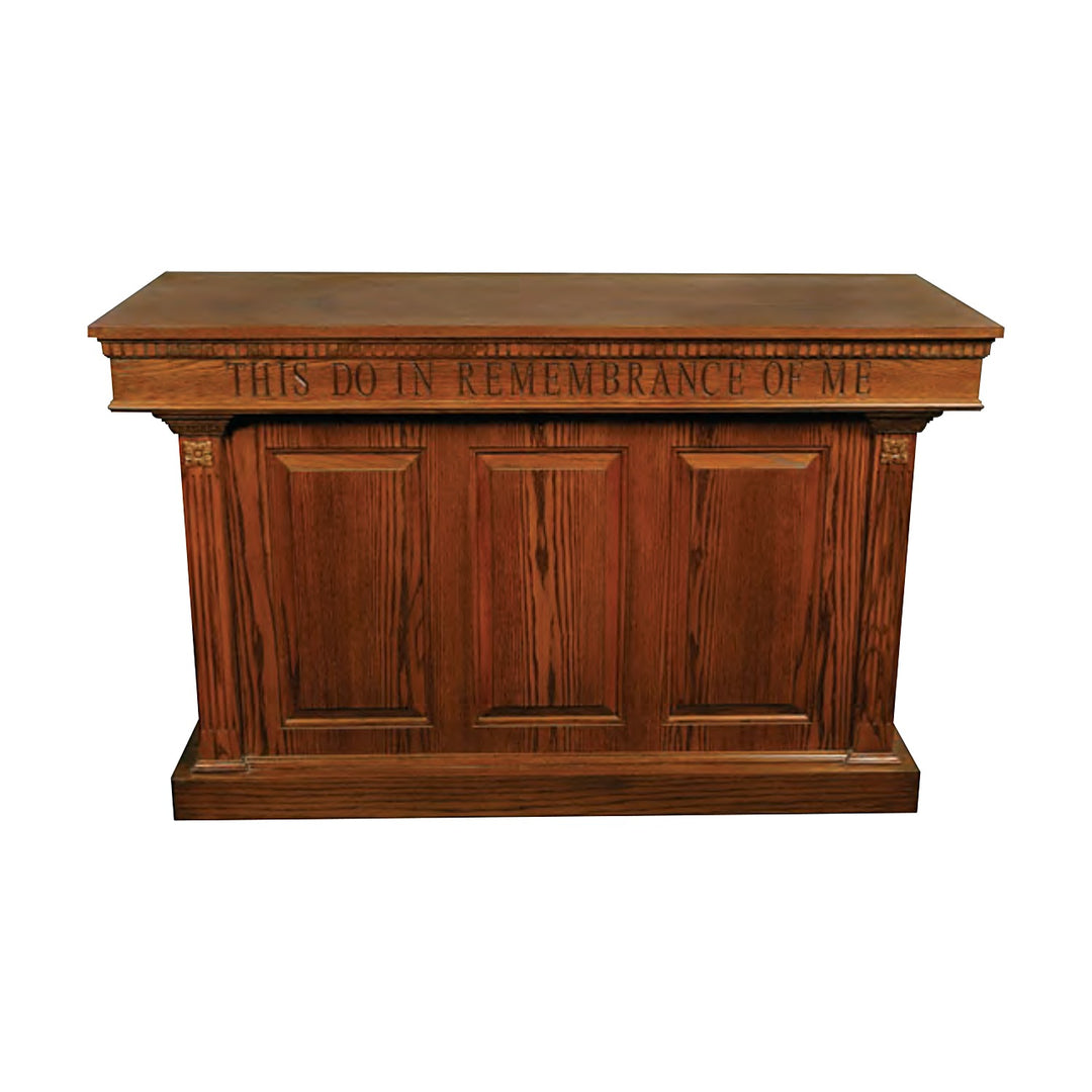 NO 8201 closed communion table in all-stained oak with raised panels and carved inscription
